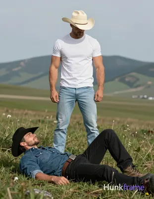 Two adult men in a rugged outdoor muscle bear scene. Standing subject faces away