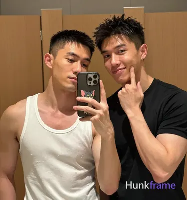 Photograph of exactly 2 adult men. Man 1: Asian, light-medium, square-jawed with defined cheekbones,